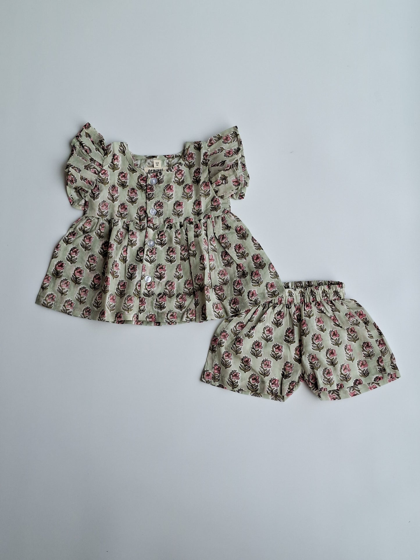 atibatti-girl-newborn-dress-set-pastel-handblock-print-flat-lay