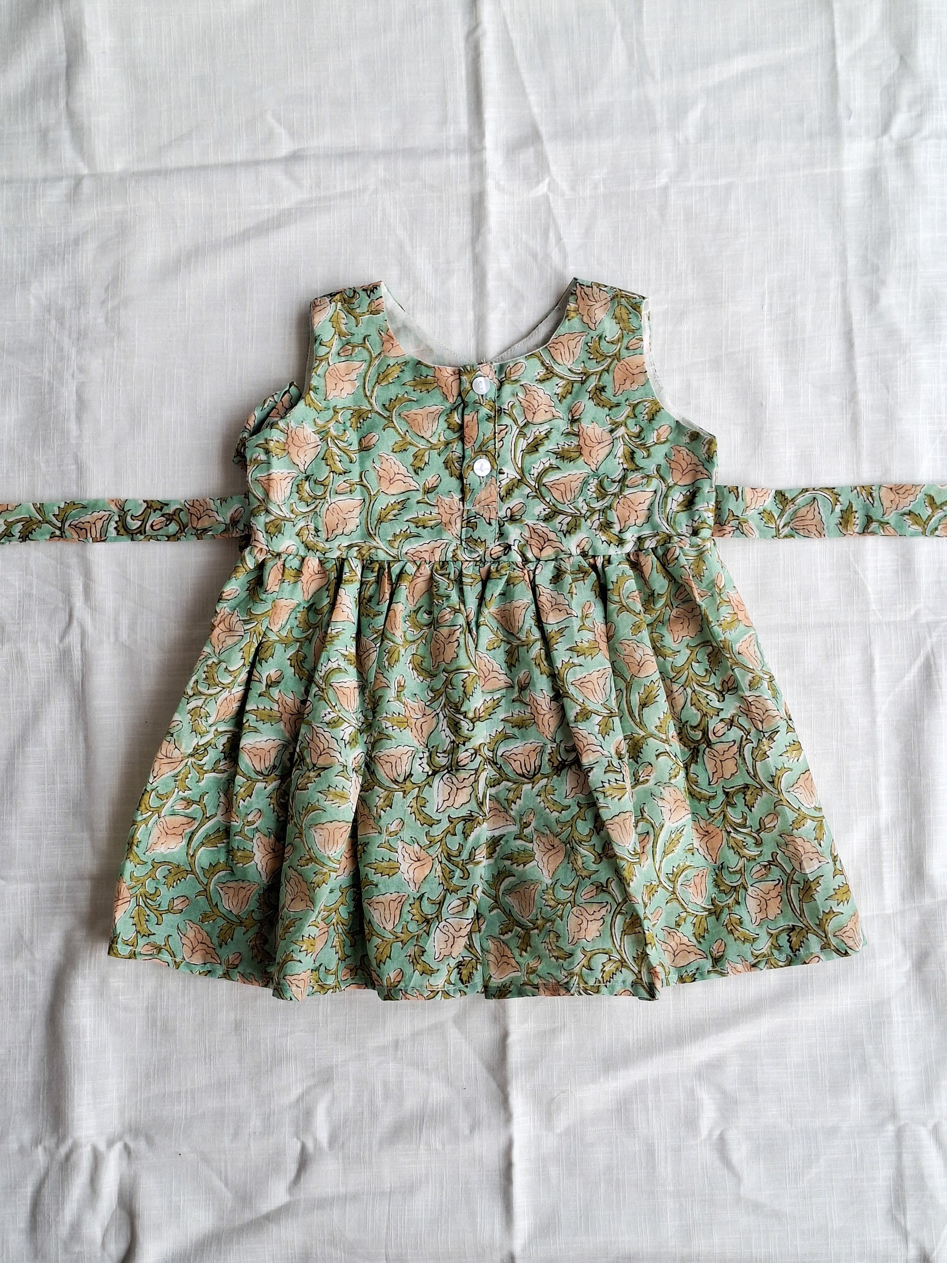 atibatti-green-handblock-baby-girl-cotton-dress-flatlay
