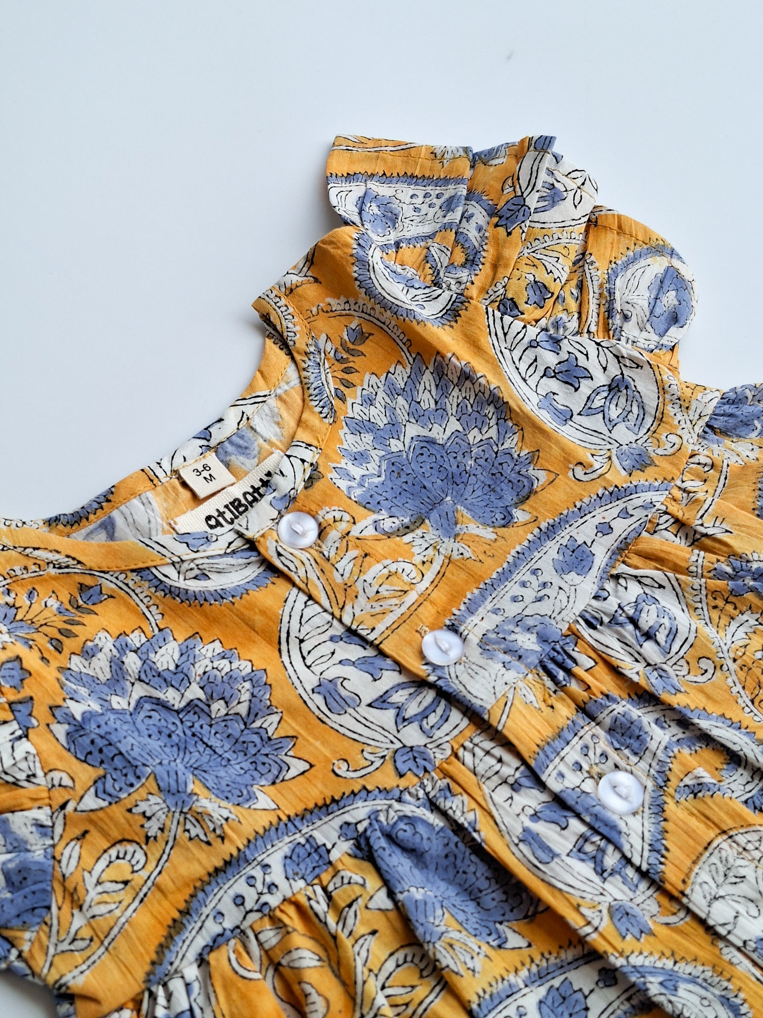 atibatti-newborn-dress-set-mustard-handblock-print-closeview