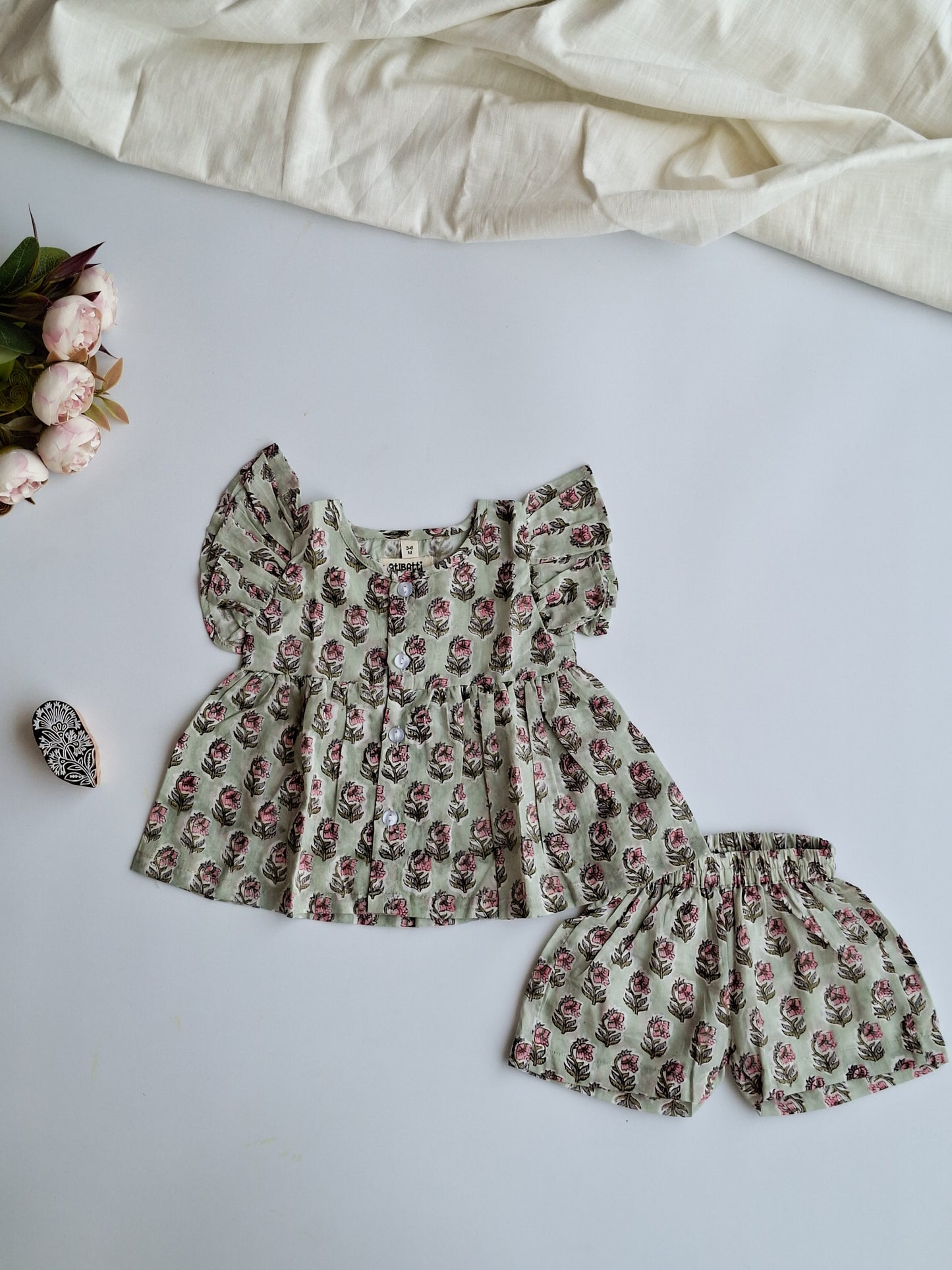 atibatti-newborn-dress-set-pastel-handblock-print-flat-lay