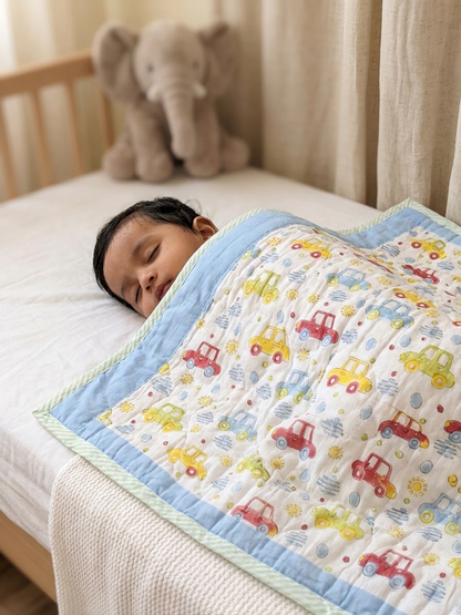 baby sleeping on cotton baby quilt atibatti
