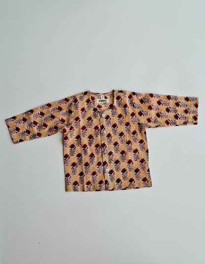 cream rose soft cotton jhabla for newborn with traditional Indian handblock print top view 