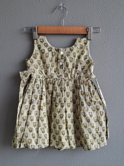 green handblock print baby girl cotton dress back view