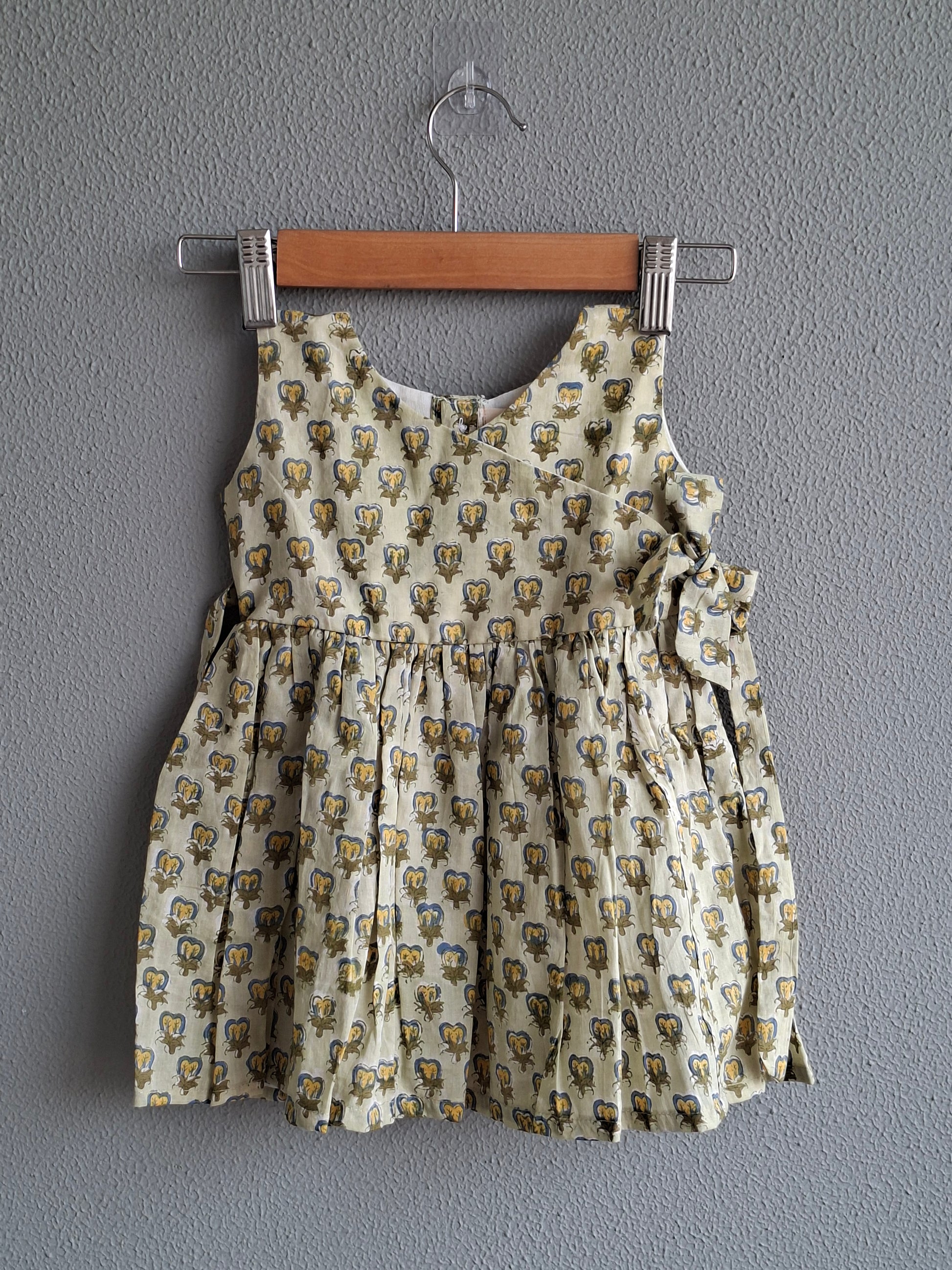 green handblock print baby girl cotton dress flat lay