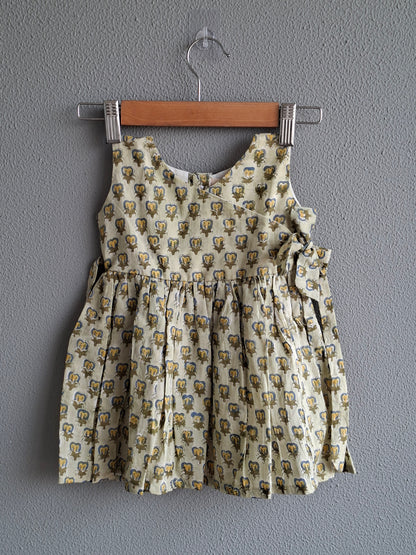 green handblock print baby girl cotton dress flat lay