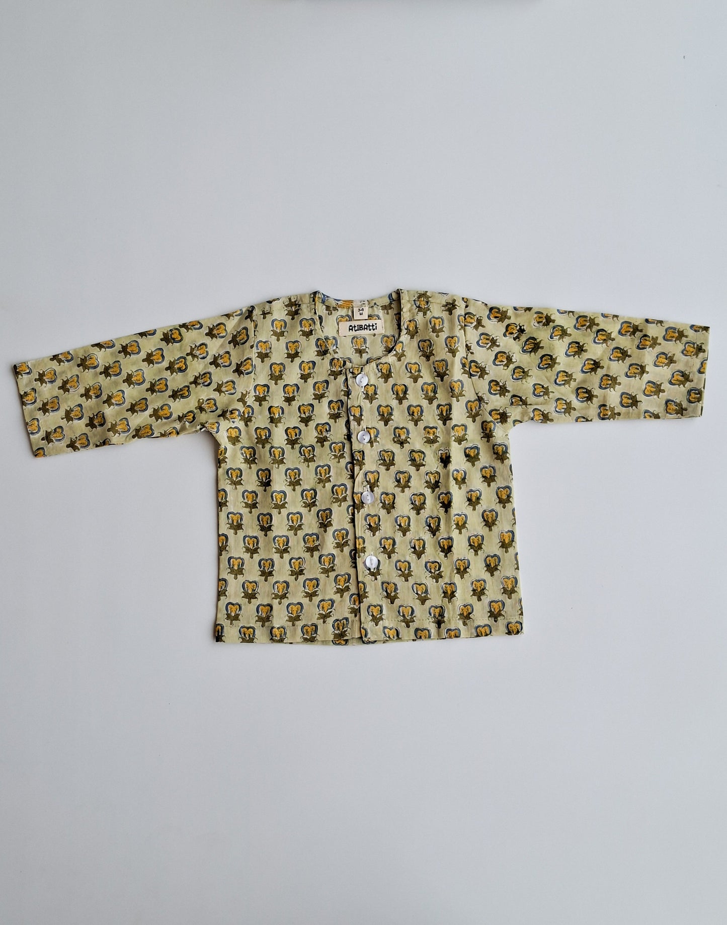 green handblock printed mulmul cotton jhabla for newborn baby top view