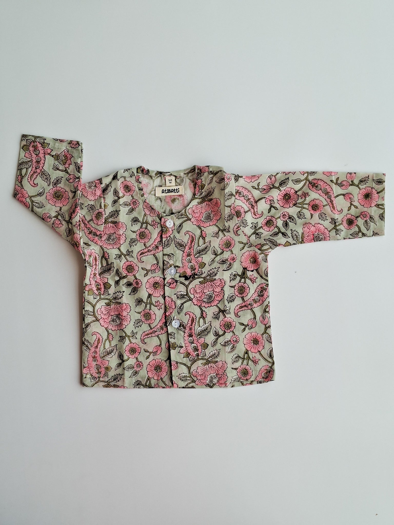 pastel floral soft cotton jhabla for newborn with traditional Indian handblock print top view with sleeves