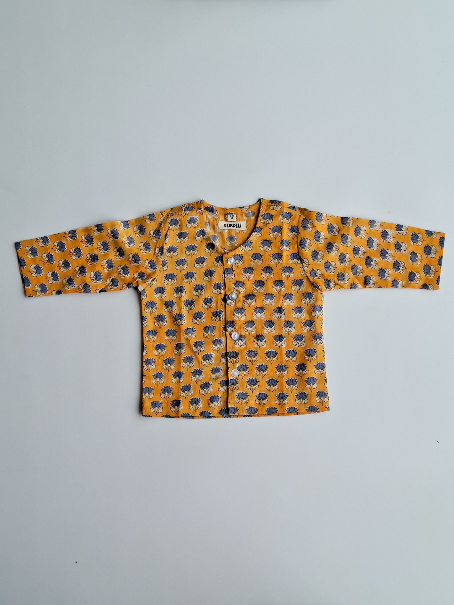 yellow blue lotus soft cotton jhabla for newborn with traditional Indian handblock print top view